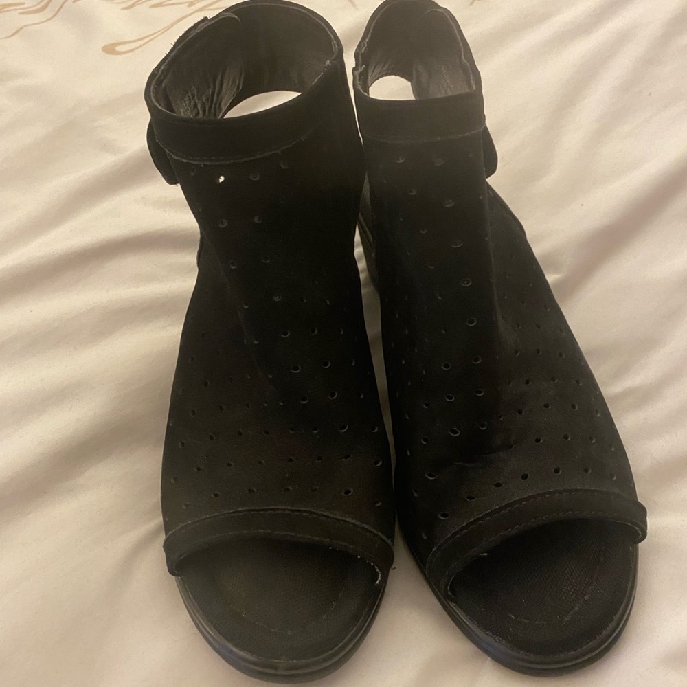 Black peek-a-boo toe booties. Size 10. 2 1/2 inch heel. Steven Madden.
